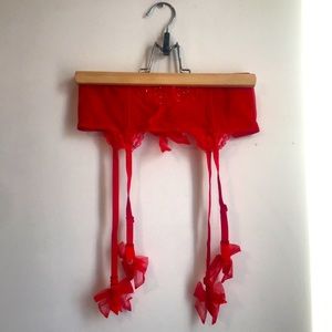 Victoria Secret red garterbelt. Size small. With coloured rhinestones and bows